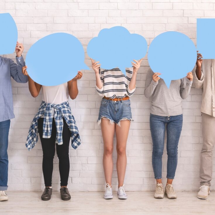 people holding blue speech bubbles